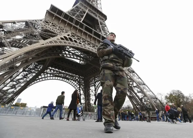 Soldiers patrol the Eiffel Tower after deadly attacks in Paris