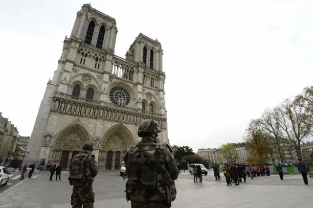 French soldiers patrol in front of Notre-Dame de Paris Cathedral in Paris on November 14, 2015,