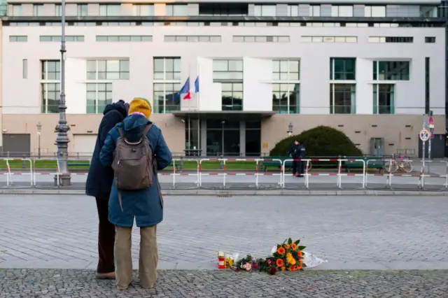 Flowers are laid at the French embassy in Berlin