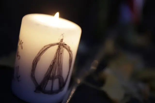 A candle at the Place de la Republique, Paris, in tribute to the victims of the Paris attacks