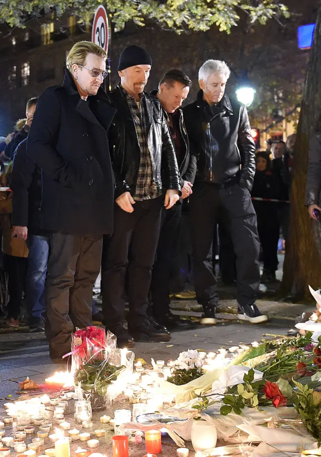 U2 stand outside Bataclan concert hall