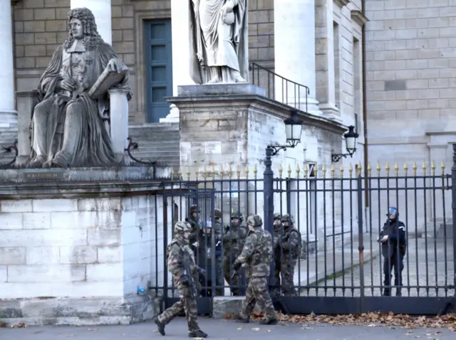 Soldiers outside the National Assembly building in Paris on 14 November 2015