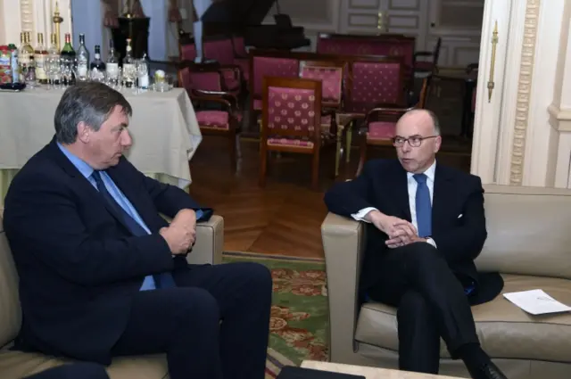 Belgian interior minister Jan Jambon (L) meets Bernard Cazeneuve