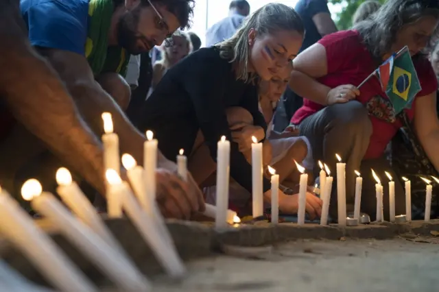 Candles at a memorial in Rio de Janeiro