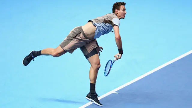 Tomas Berdych serves