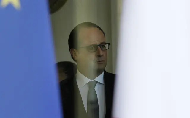 French President Francois Hollande is seen at the Elysee Palace in after a security meeting, on November 14, 2015