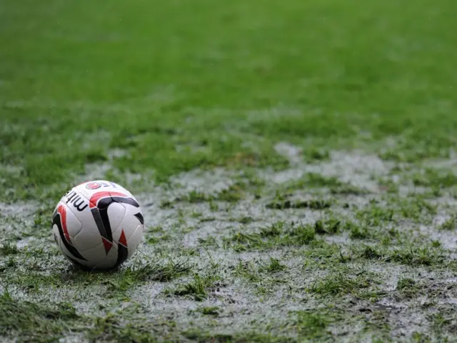 Football on a waterlogged pitch