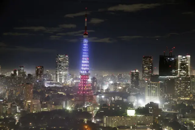 Tokyo Tower lit up in red, white and blue