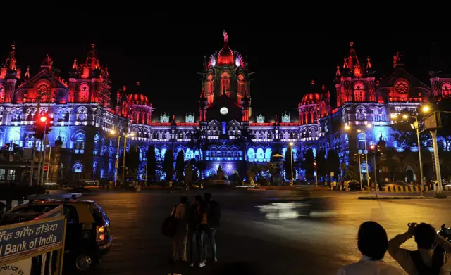 Mumbai's main railway station, the Chhatrapati Shivaji Terminus, is lit up in the colours of the French national flag