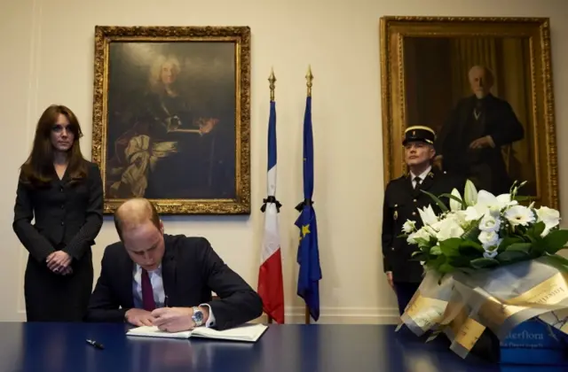 Prince William signing book of condolence