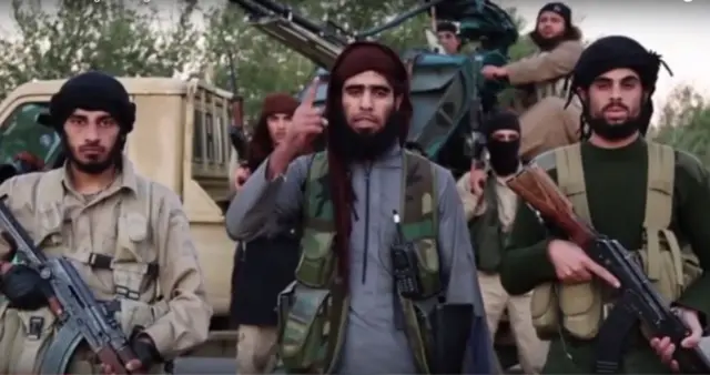 Islamic State (IS) militants appear in a video published on 16 November 2015