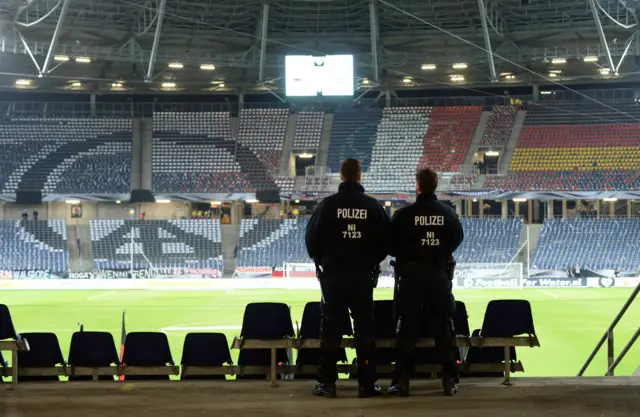 Police look over an empty Hannover Stadium