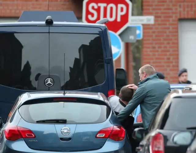 A man is arrested by police in Alsdorf, near Aachen, Germany (17 November 2015)