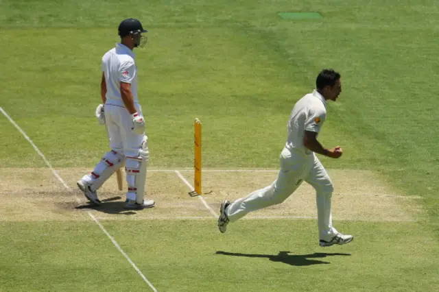 Mitchell Johnson celebrates the wicket of Jonathan Trott