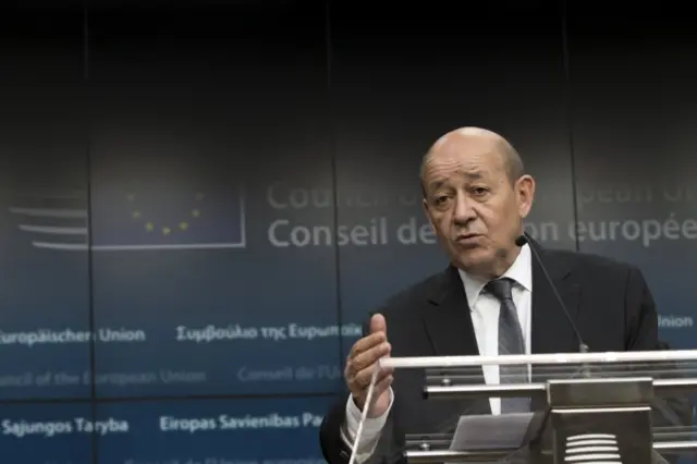 French Defence Minister Jean-Yves Le Drian speaks to reporters in Brussels