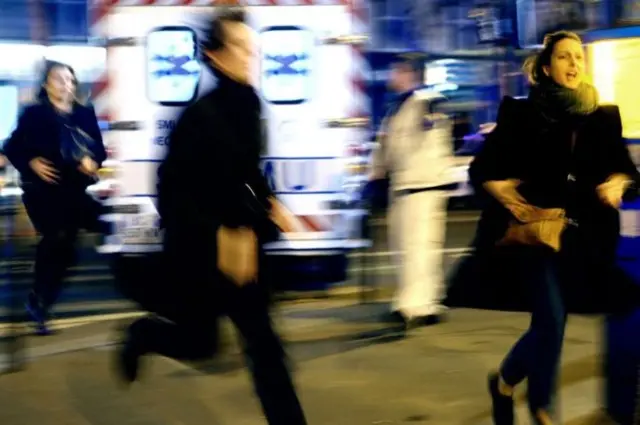 People running near emergency vehicles