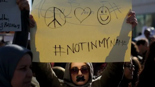 Woman holding sign