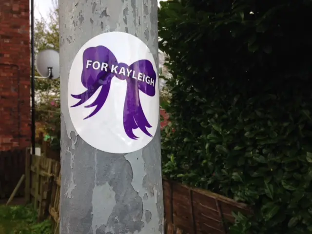 Sticker with purple ribbon