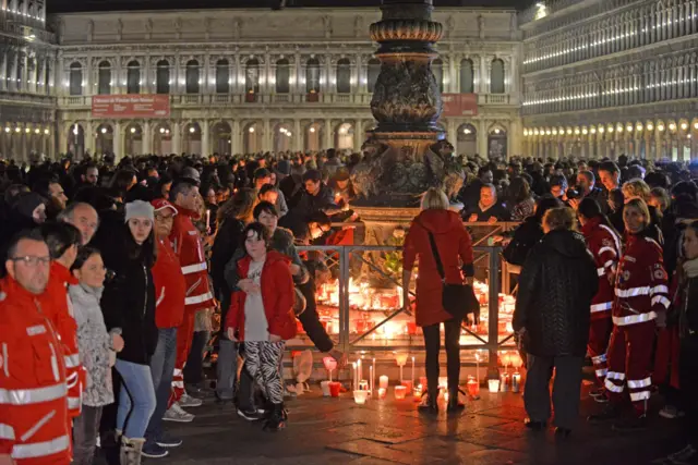 People attend a candlelight vigil on Piazza San Marco to remember Italian Valeria Solesin, who died during the Paris attacks,