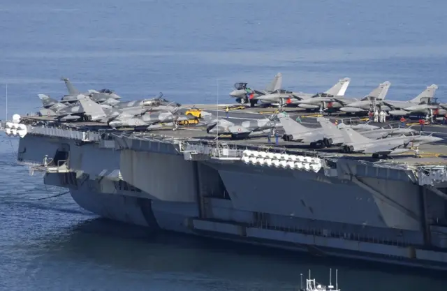 War planes on the deck of France"s nuclear-powered aircraft carrier Charles de Gaulle