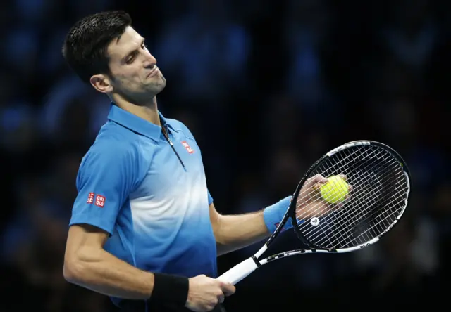 Novak Djokovic reacts after losing a point