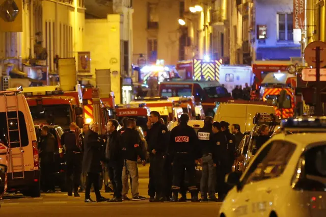 Police forces, firefighters and rescue workers secure the area near the Bataclan concert hall in central Paris, on 14 November 2015