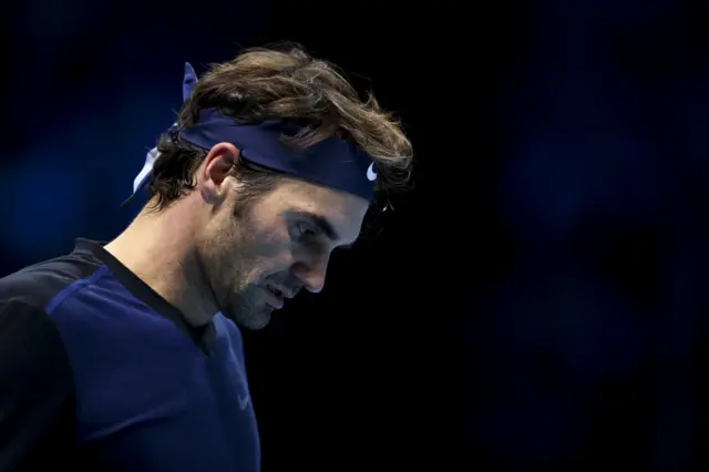 Roger Federer reacts after a point