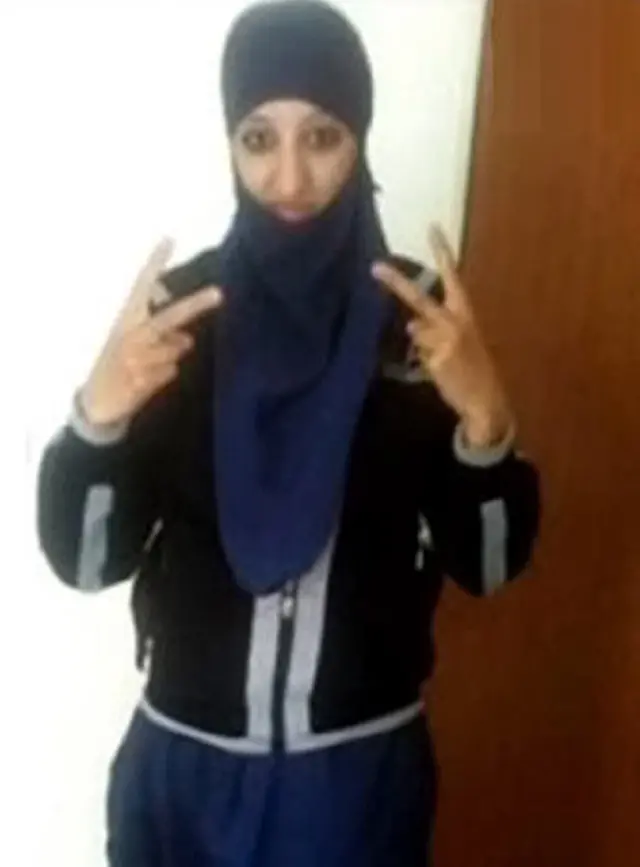 This picture showing a woman in a hijab using both hands to stick two fingers up to the camera, is said to be the female suicide bomber who blew herself up as police raided a flat in Saint-Denis yesterday.