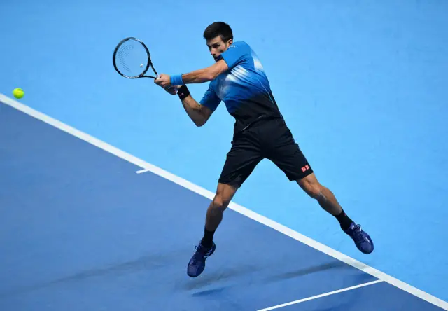 Novak Djokovic hits a return