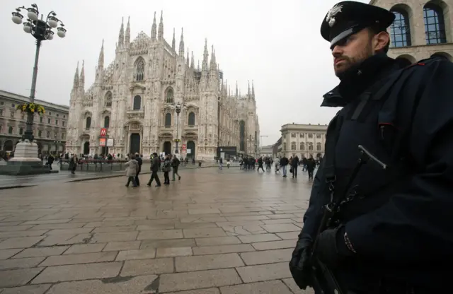 Italian Carabinieri police patrol in Duomo Square Milan, northern Italy, 19 November 2015.