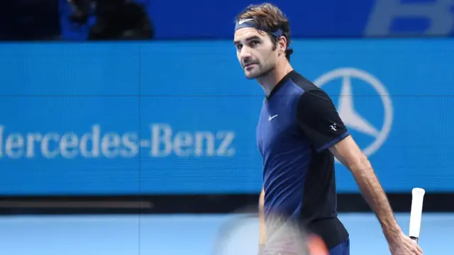 Roger Federer reacts after losing a point