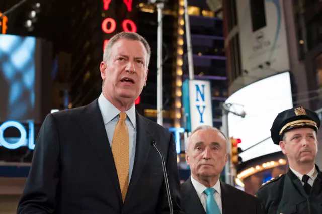 Mayor of New York City, Bill de Blasio and New York City Police Commissioner, William Bratton deliver remarks at a news conference in Times Square in the Manhattan borough in New York