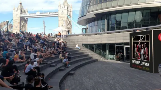 A mock-up of what people watching a film by City Hall would look like