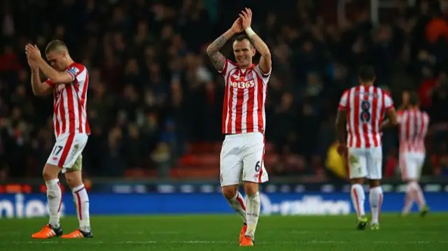 Stoke players applauding fans after Chelsea win