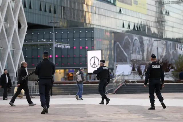 French policemen patrol at La Defense business district in Nanterre after a series of deadly attacks in Paris, France, November 18, 2015.