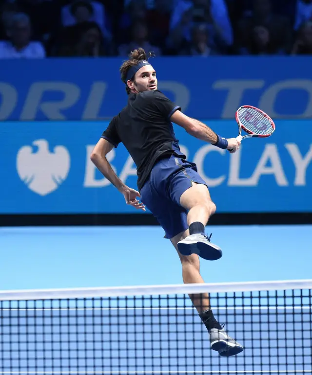 Roger Federer hits a return