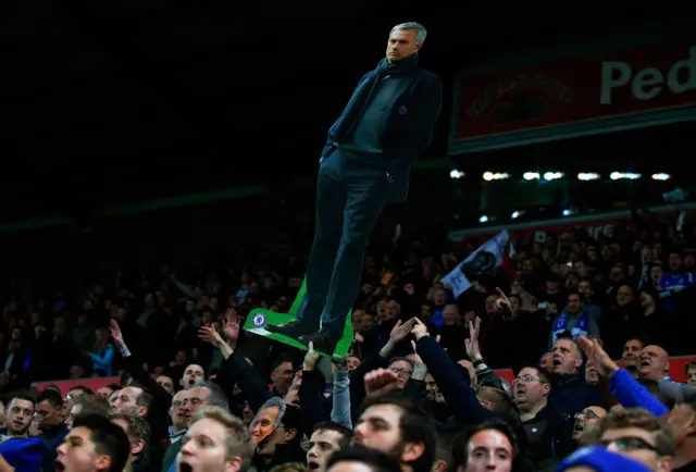 A jose Mourinho cut out is held by a fan