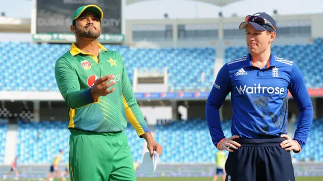 Azhar Ali tosses the coin alongside England captain Eoin Morgan