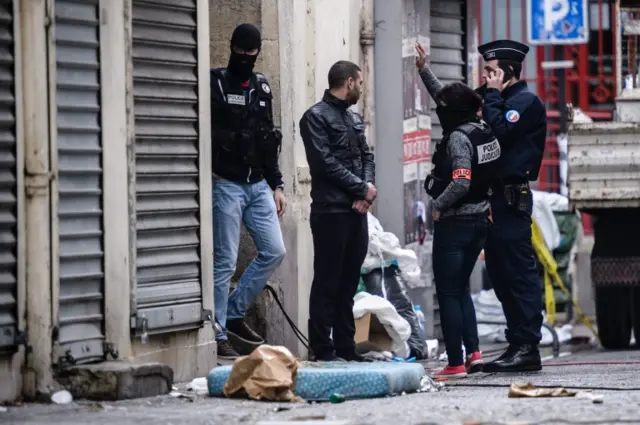 French police outside the 8 rue du Corbillon building in Saint-Denis