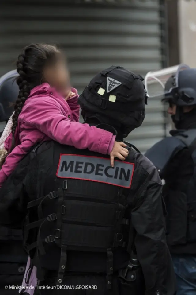 police raided a flat in a northern Paris suburb, leading to scenes that witnesses said resembled a warzone