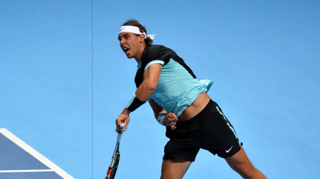 Rafael Nadal serves