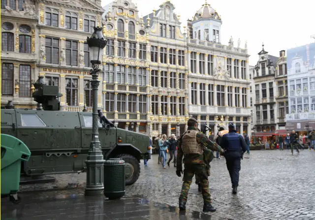 A Belgian soldier patrols on Brussels Grand Place in central Brussels after security was tightened in Belgium following the fatal attacks in Paris