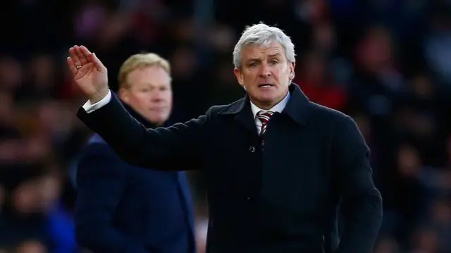 Mark Hughes makes a gesture