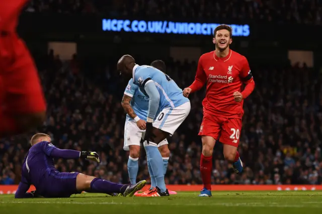 Adam Lallana runs away as Mangala scores an own goal