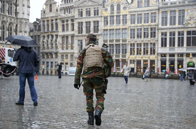 A Belgian soldier patrols on Brussels Grand Place in central Brussels after security was tightened in Belgium following the fatal attacks in Paris