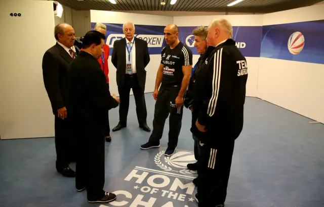 Arthur Abrahams receives instructions ahead of the fight from WBO officials