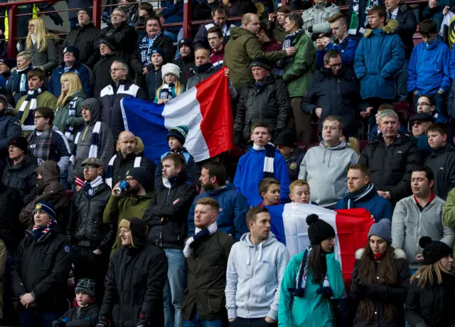 Dundee fans displaying France flags at Tynecastle