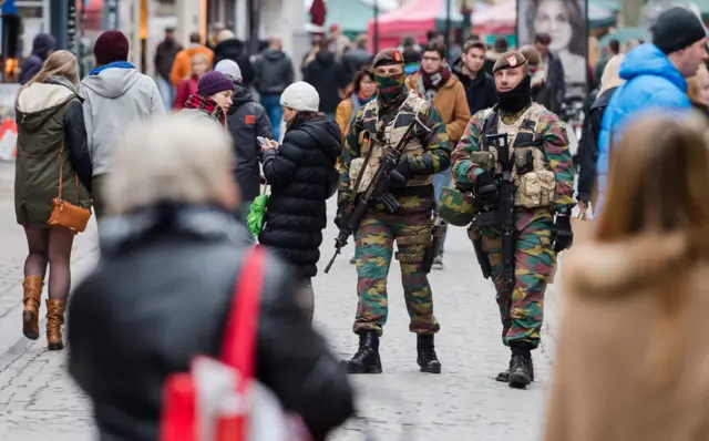 Soldiers from the Belgian army patrol in the picturesque Grand Place in Brussels