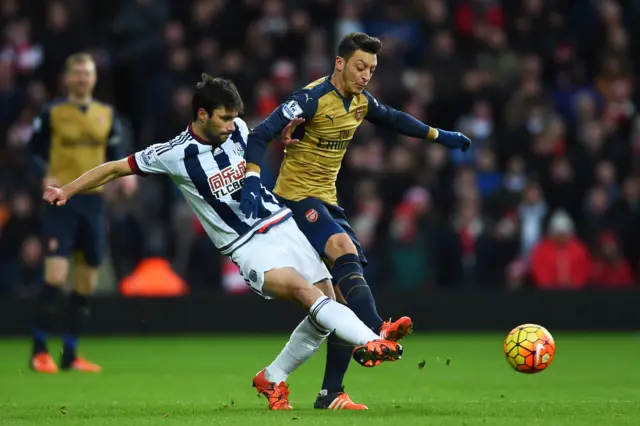 Claudio Jacob tackles Mesut Ozil