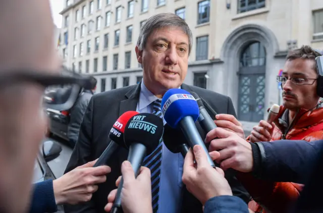 Belgian Interior Minister Jan Jambon speaks to the media as he arrives at an extraordinary State National Security Council in Brussels, Belgium,